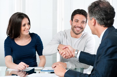 image of business partners meeting with insurance agent